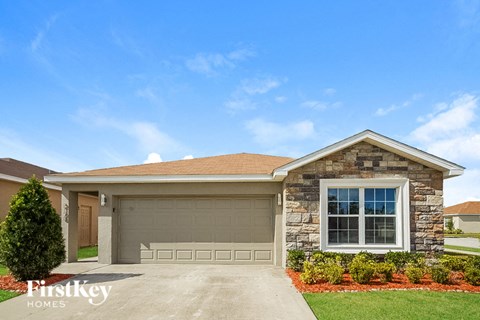 a house with a driveway and a garage door