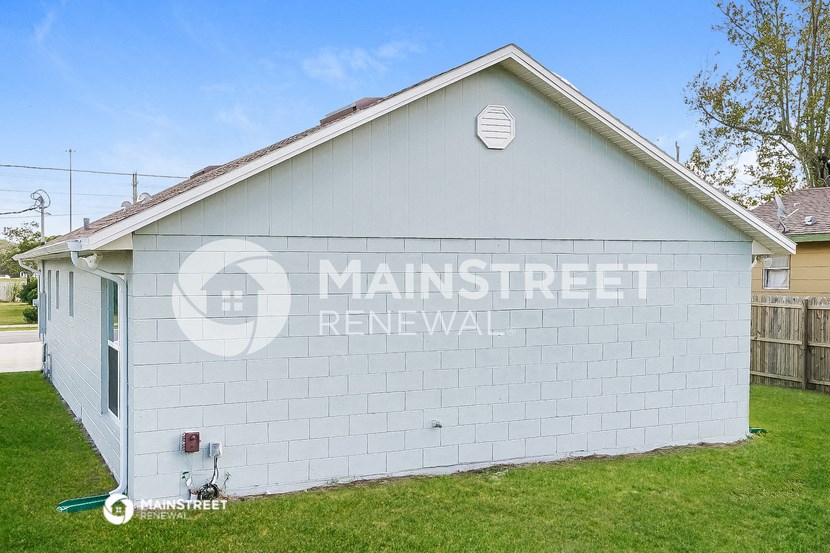 a white brick building with the words renewal on the side