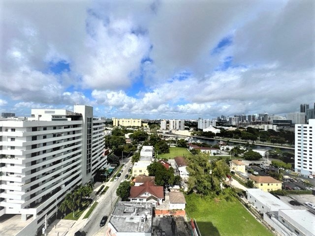 a view of the city from the roof of a building