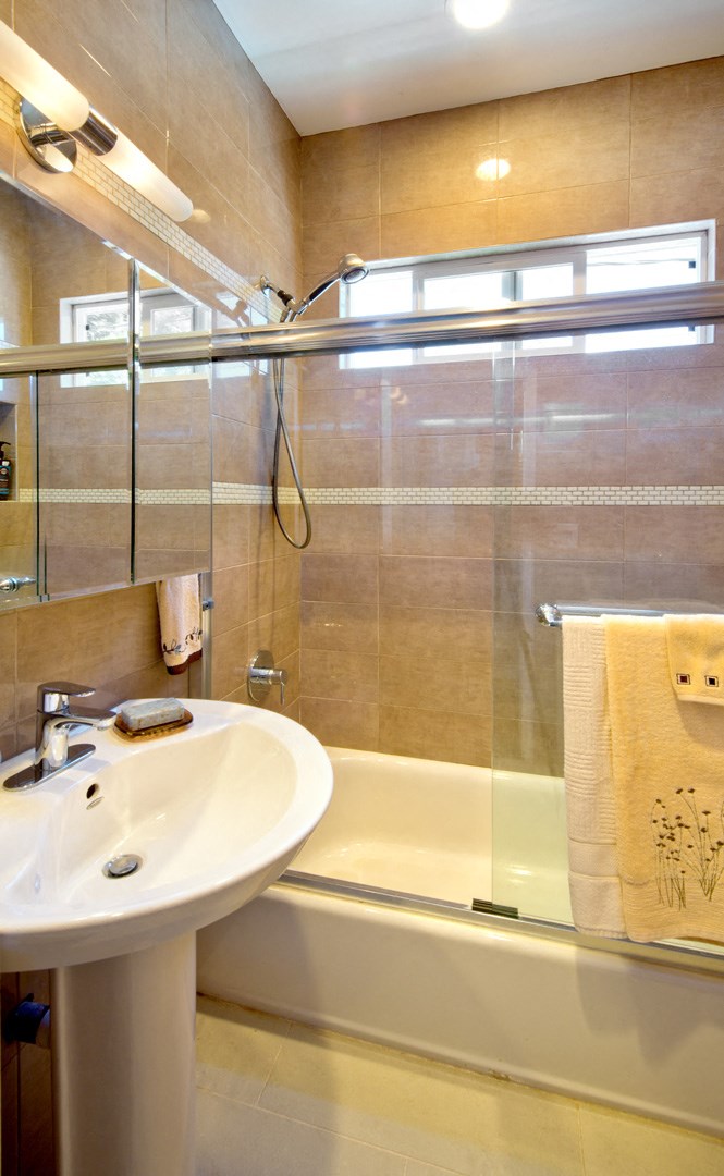 a bathroom with a sink and a shower