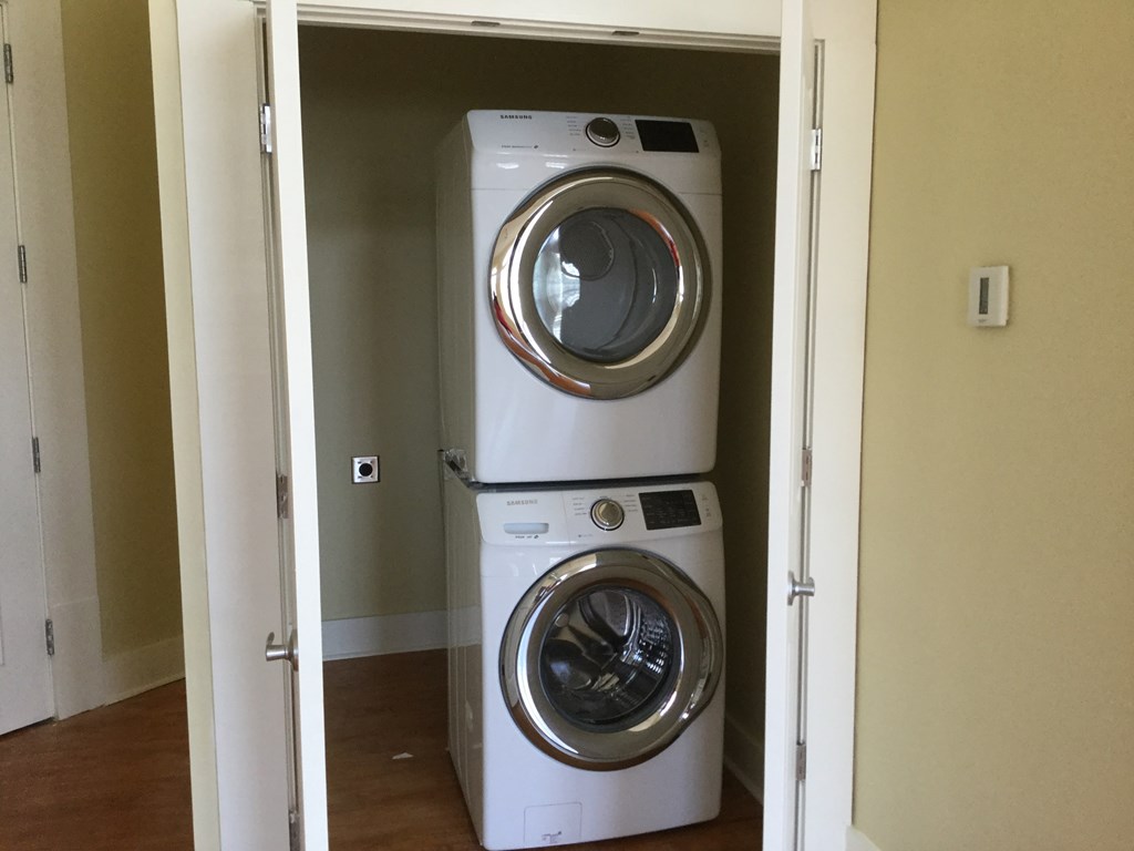 a washing machine and a dryer in a closet