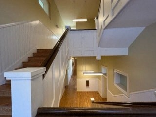 a staircase in a building with a wood floor