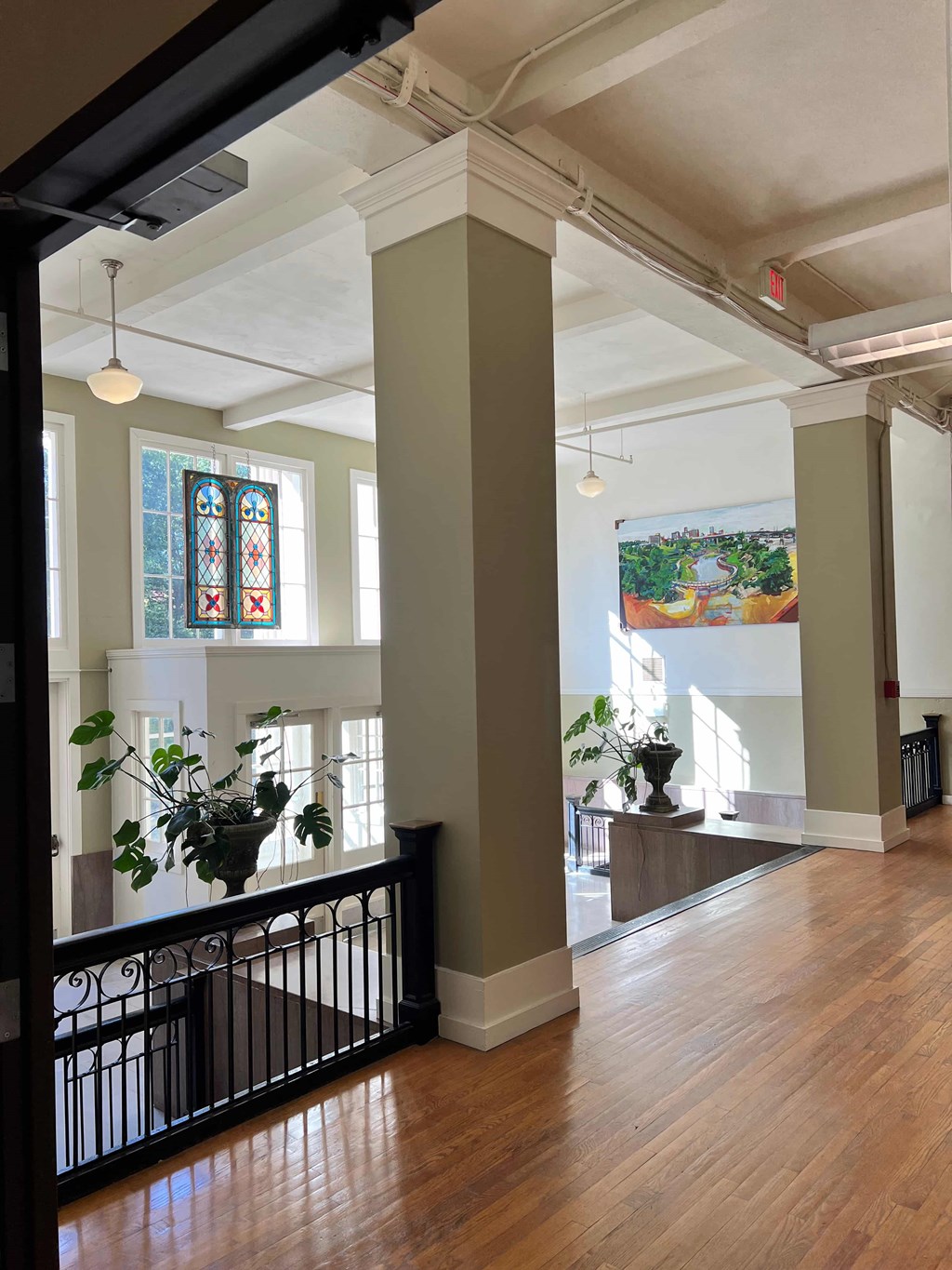 a view of the lobby of a building with a wood floor
