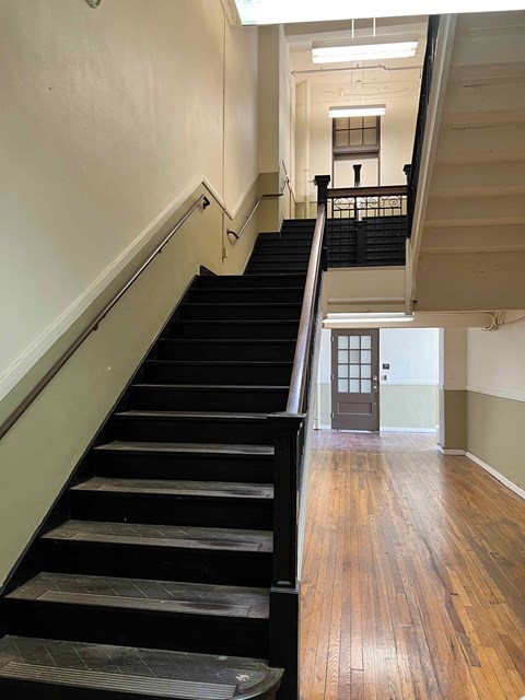 the stairs to the second floor of the building are empty