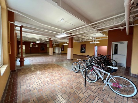a group of bikes parked in a parking garage
