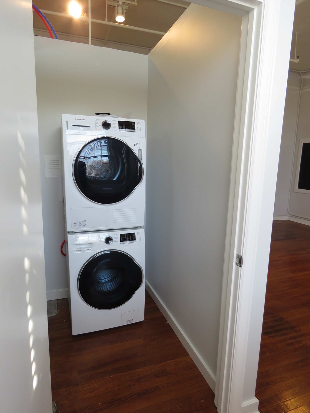 a washing machine and dryer in a small room