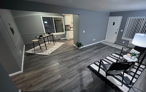 A living room with a black and white striped couch.