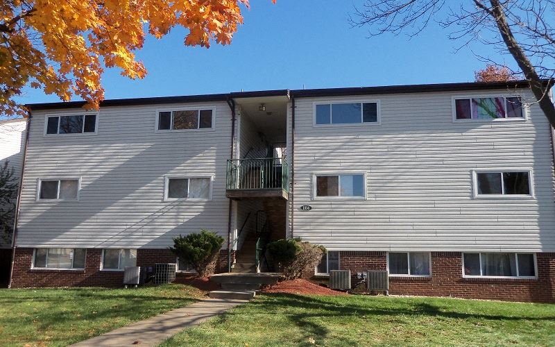 our apartments are located in a quiet neighborhood with trees and grass