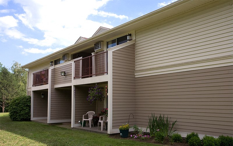 a view of the side of a house with a balcony