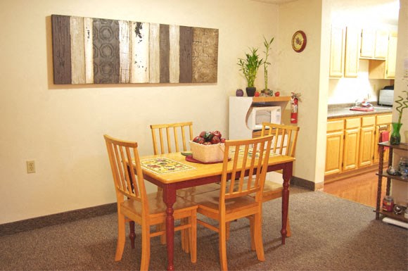 a dining room with a table and chairs