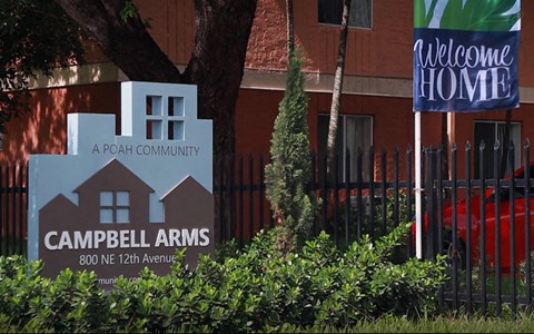 a sign in front of a building