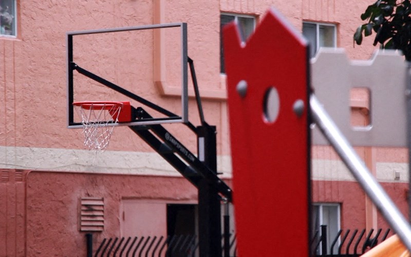 a basketball hoop in front of a building