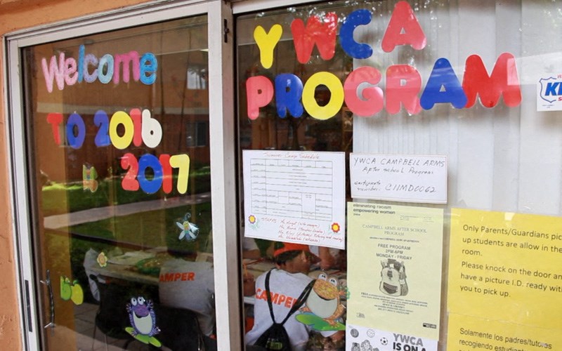 the window of a restaurant with a sign in the window stating we are a program