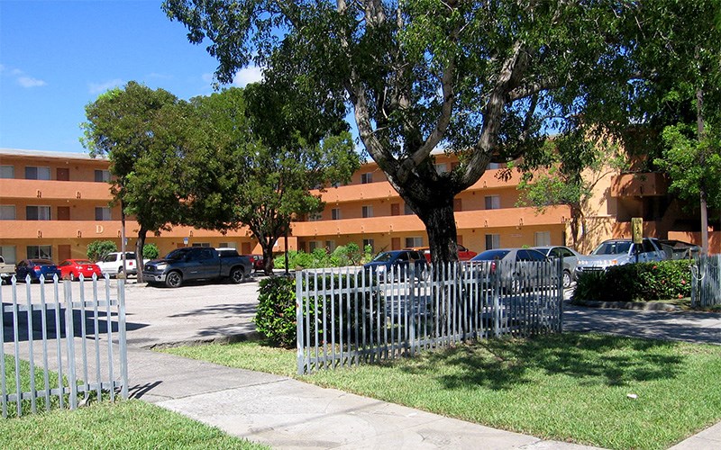 a white fence in front of an office building