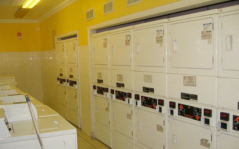 a row of lockers in a room with a bunch of doors