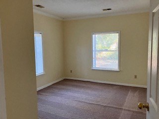 an empty room with a door and a window