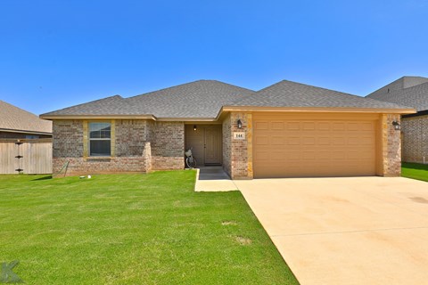 A house with a garage and a driveway.