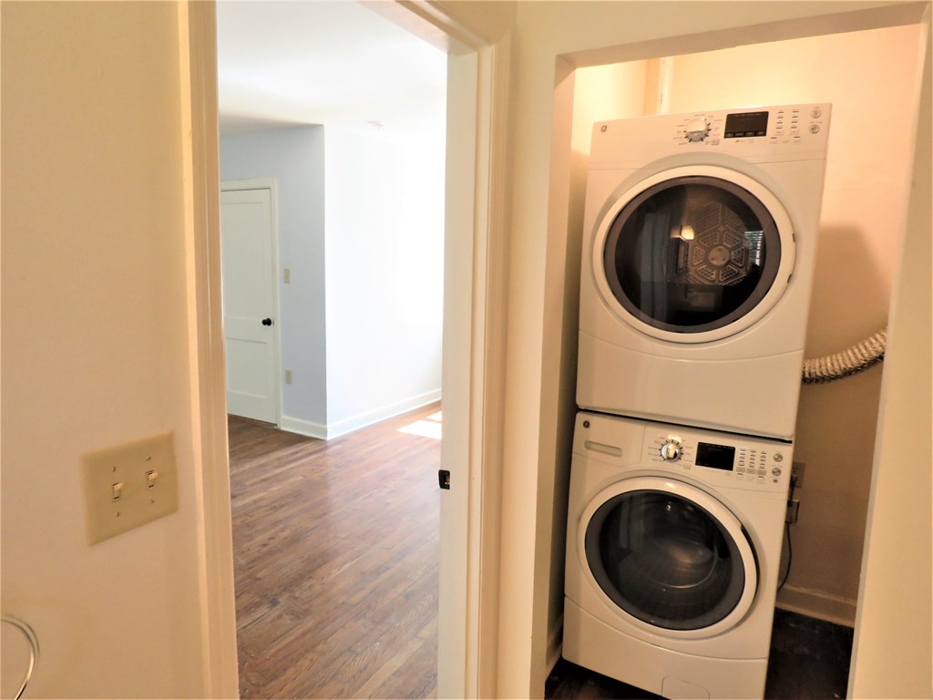a front loading washer and dryer in a laundry room