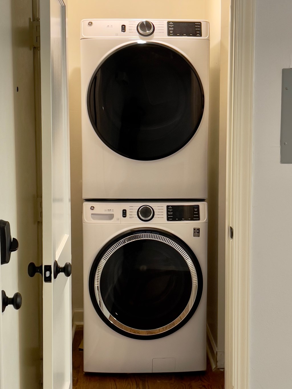 a front loading washer and dryer in a laundry room