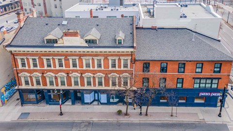 an aerial view of a building on a city street