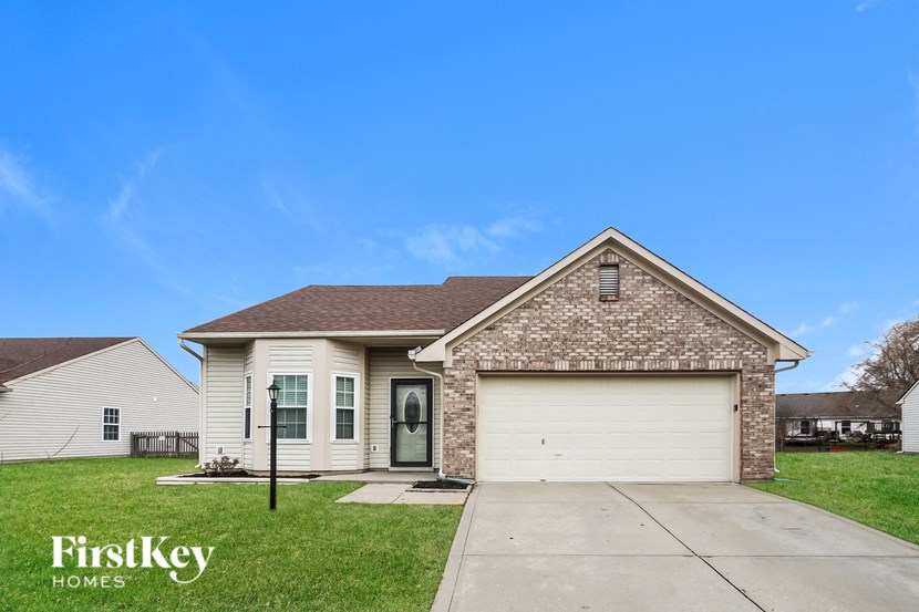 A house with a garage is for sale by FirstKey Homes.