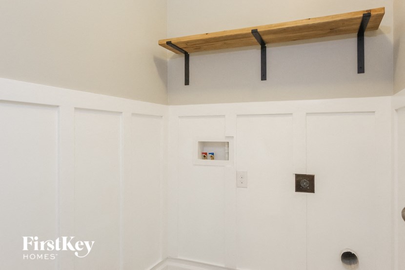 A white door with a small shelf above it.