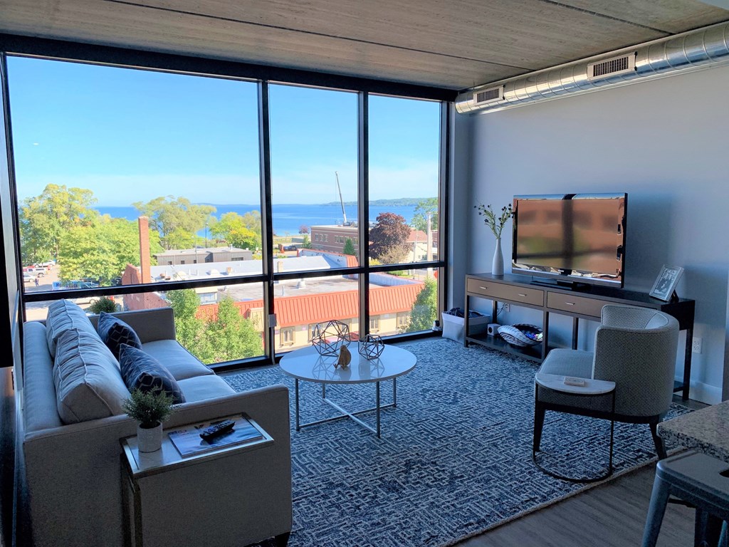 a living room with a couch and a table and a television