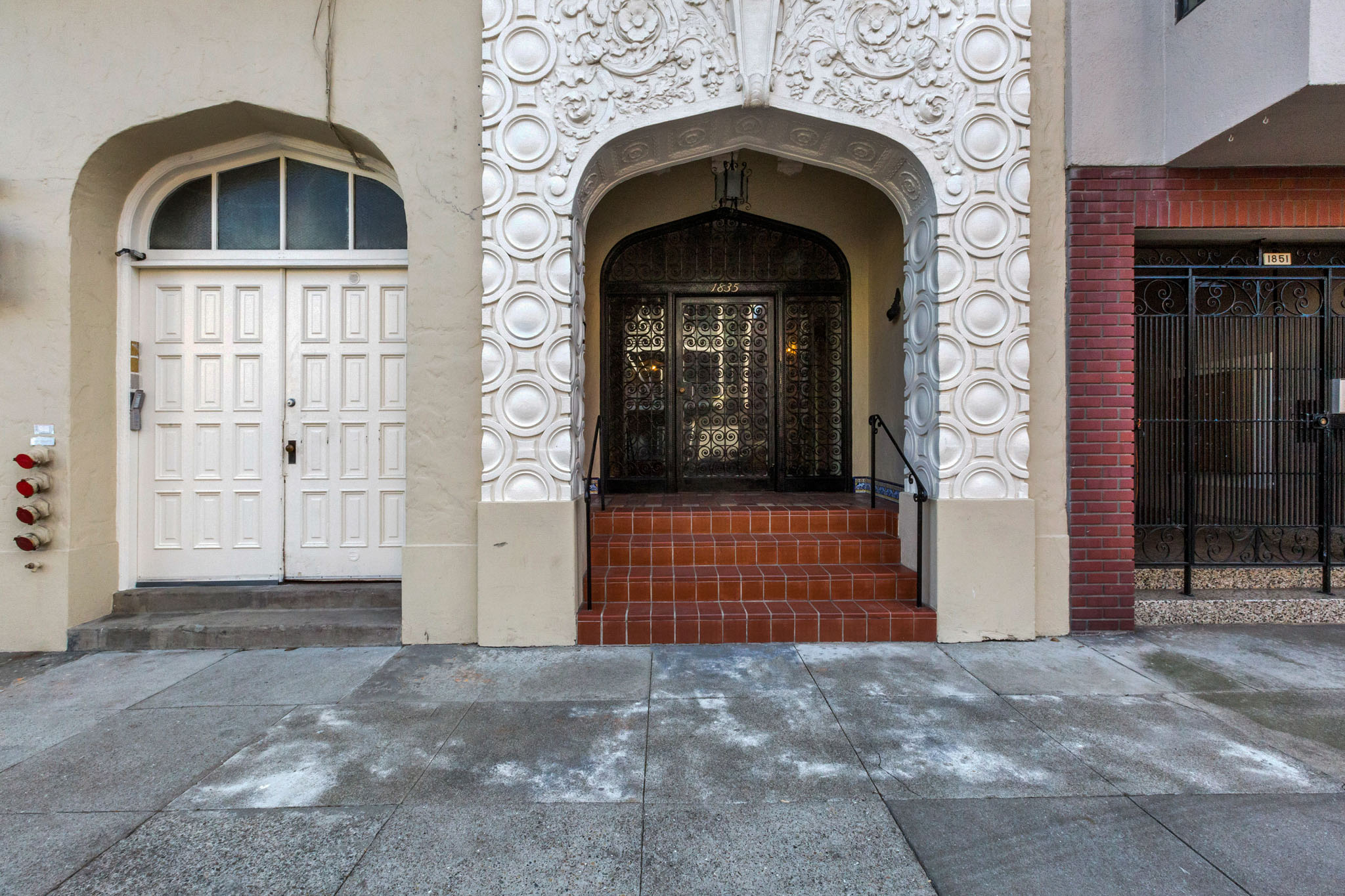A white door is on the left and a black door is on the right.