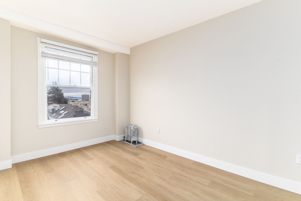 a kitchen with granite counter tops and wooden cabinets