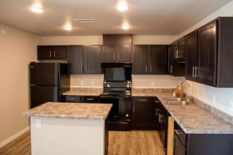 Kitchen inside home at North Moorhead Village Apartments