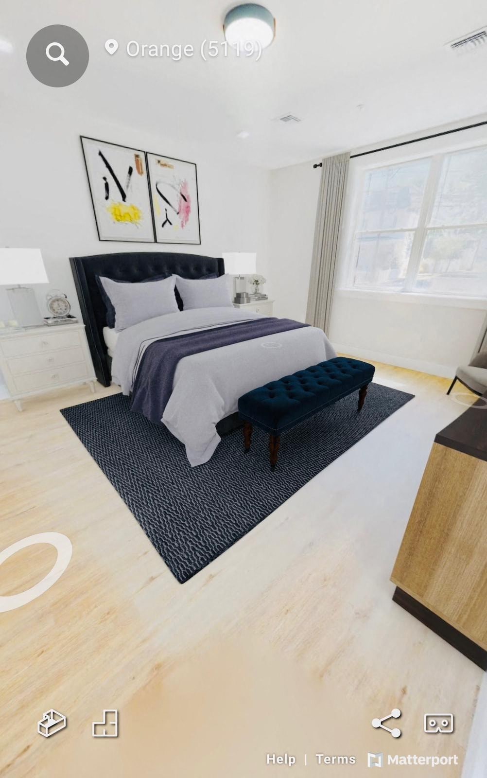 a bedroom with a bed and a chair in it