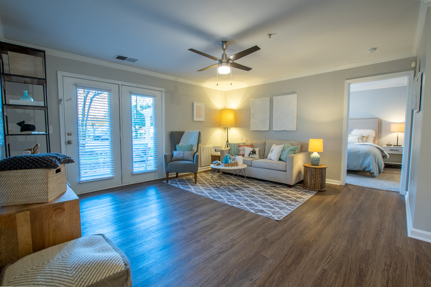 a living room with a ceiling fan and a couch