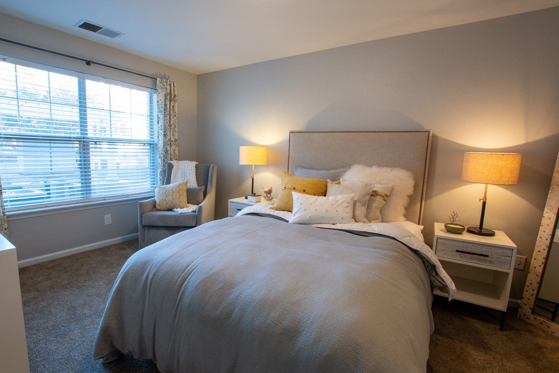 a bedroom with a large bed and a window