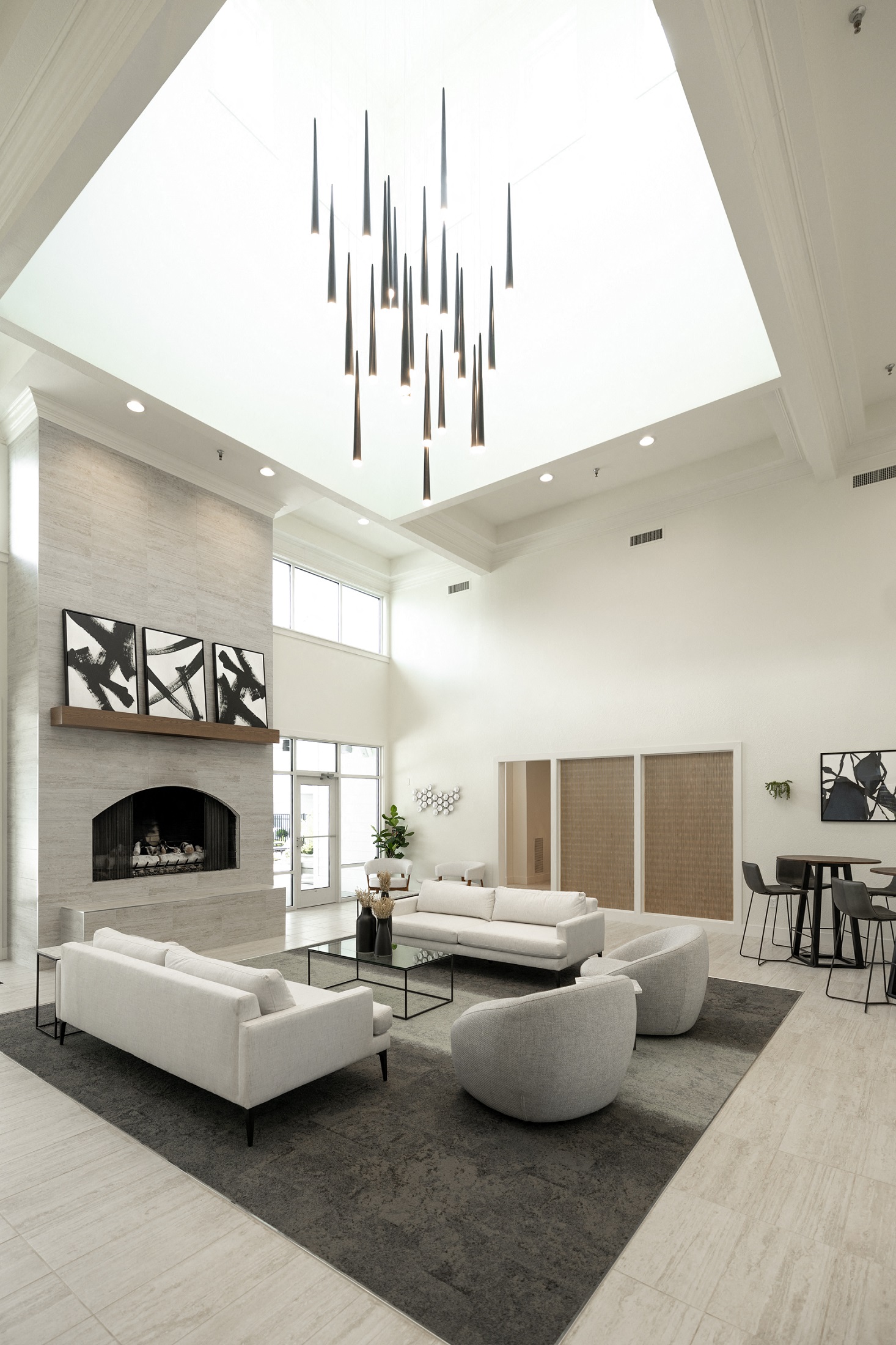 a living room with couches and chairs and a fireplace