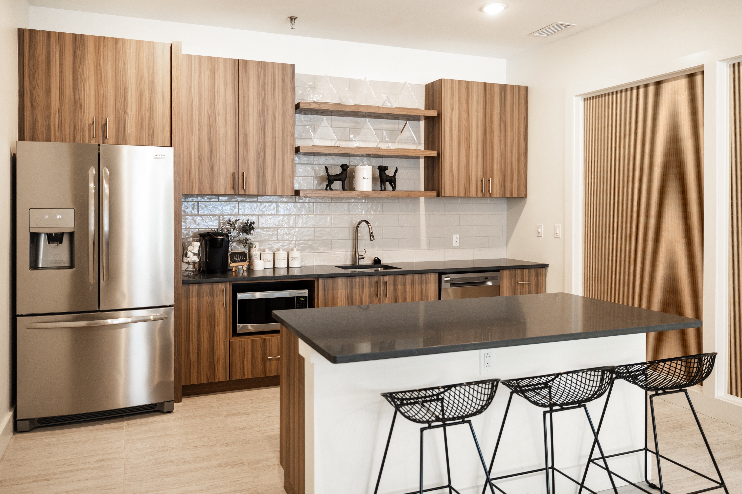a kitchen with stainless steel appliances and wooden cabinets