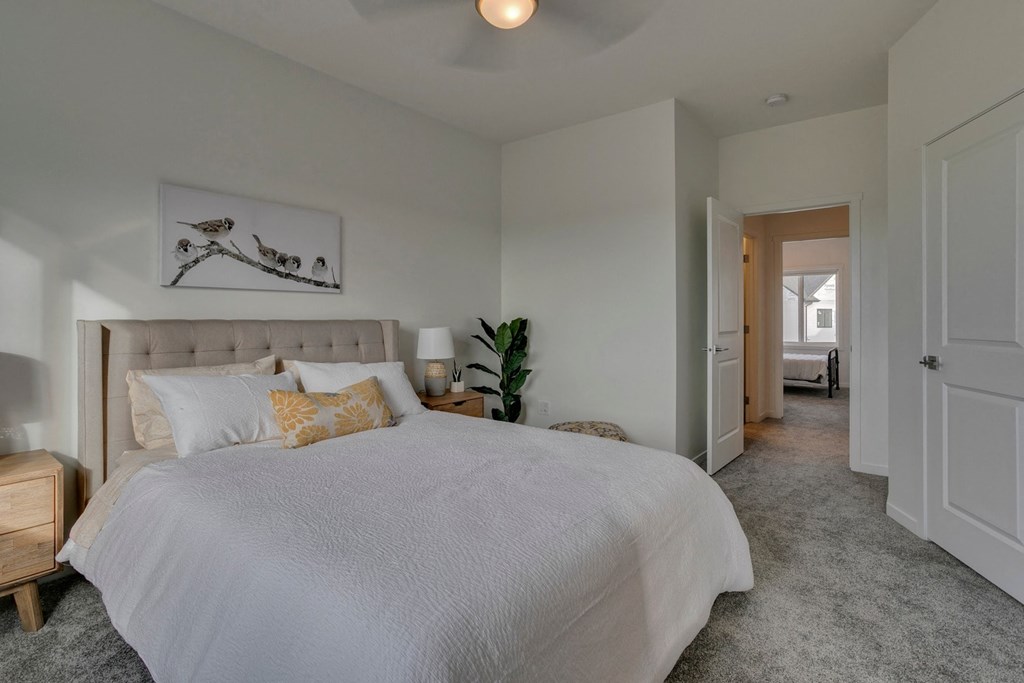 a bedroom with a large bed and a closet