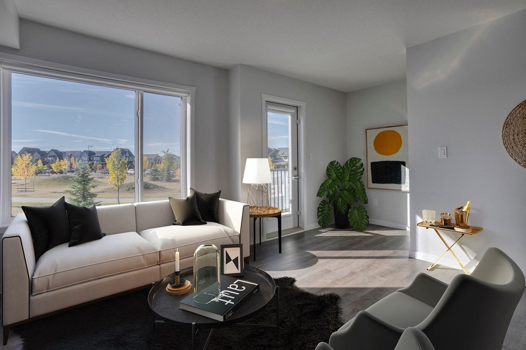 a living room with a white couch and a large window