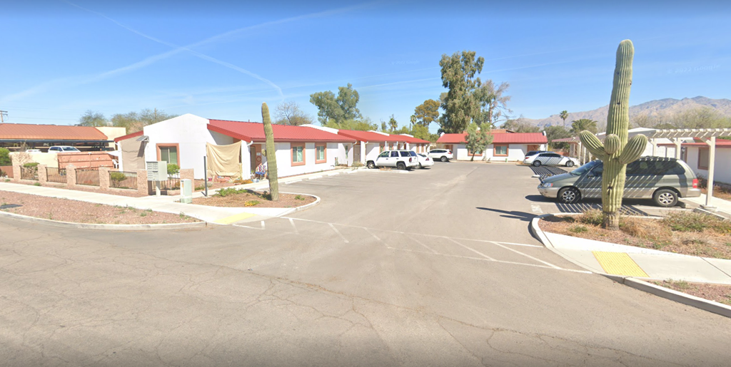 a parking lot in the middle of a street at a motel