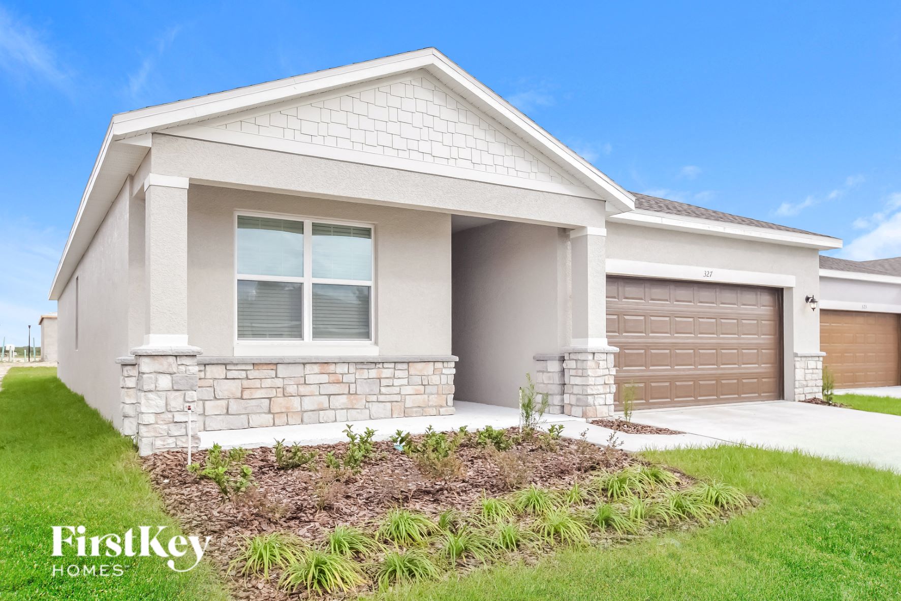 a house with a driveway and a garage door