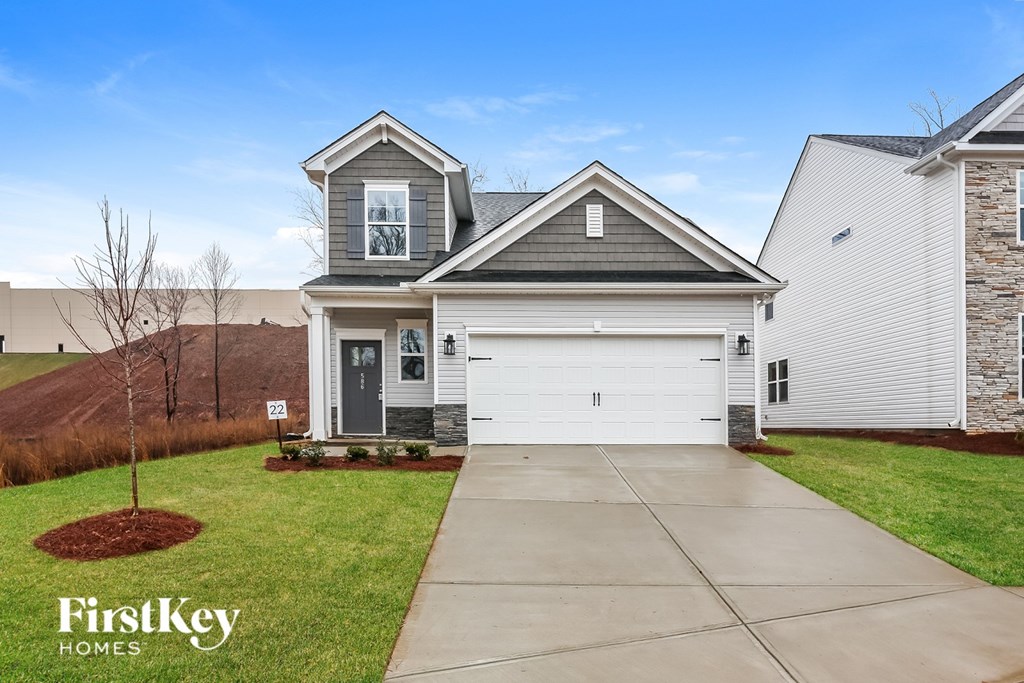 A house with a garage is for sale by FirstKey Homes.