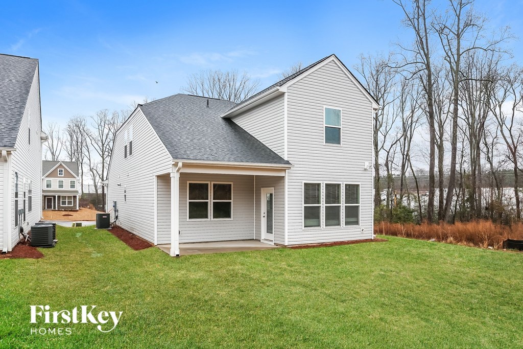 A house with a grey roof and white walls is shown with the words "FirstKey Homes" on the bottom left.