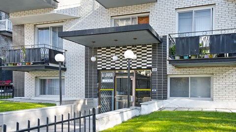 A building with a black and white checkered awning.