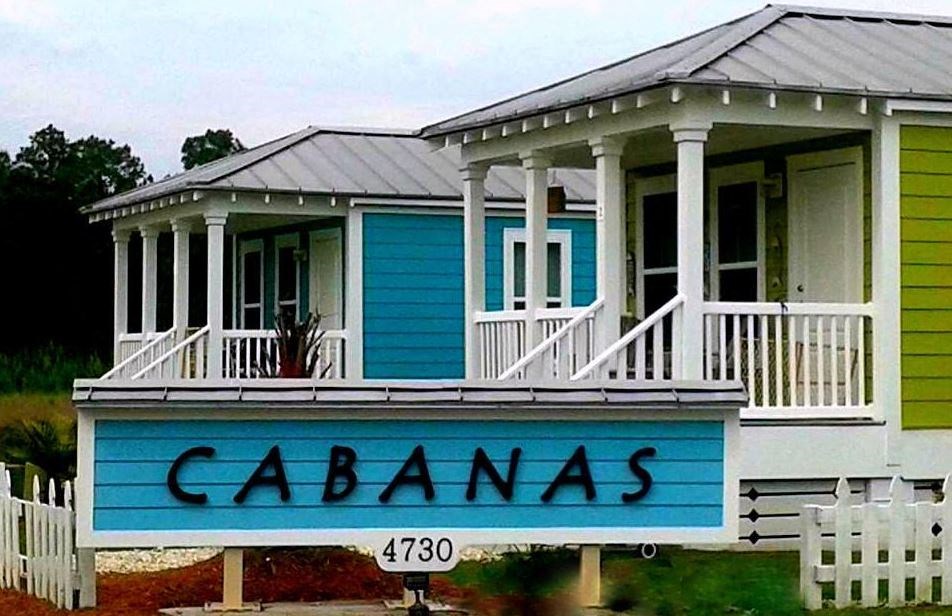 a blue sign on the front of a house