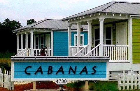 a blue sign on the front of a house