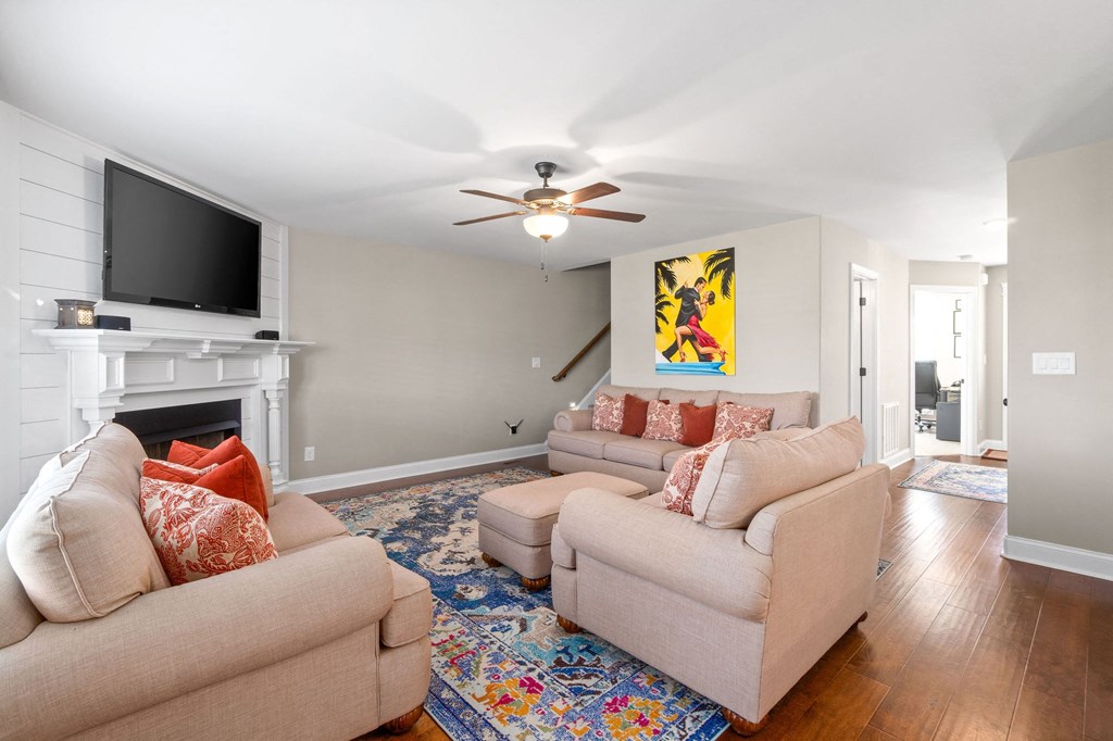 a living room with two couches and a tv