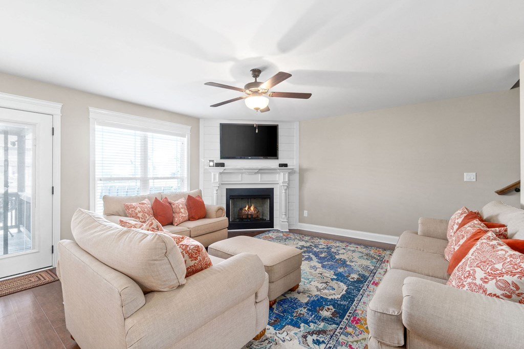 a living room with couches and a fire place