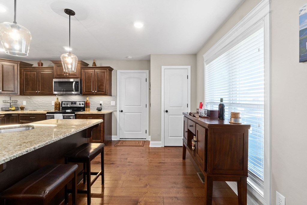 a kitchen with a large window and a counter top