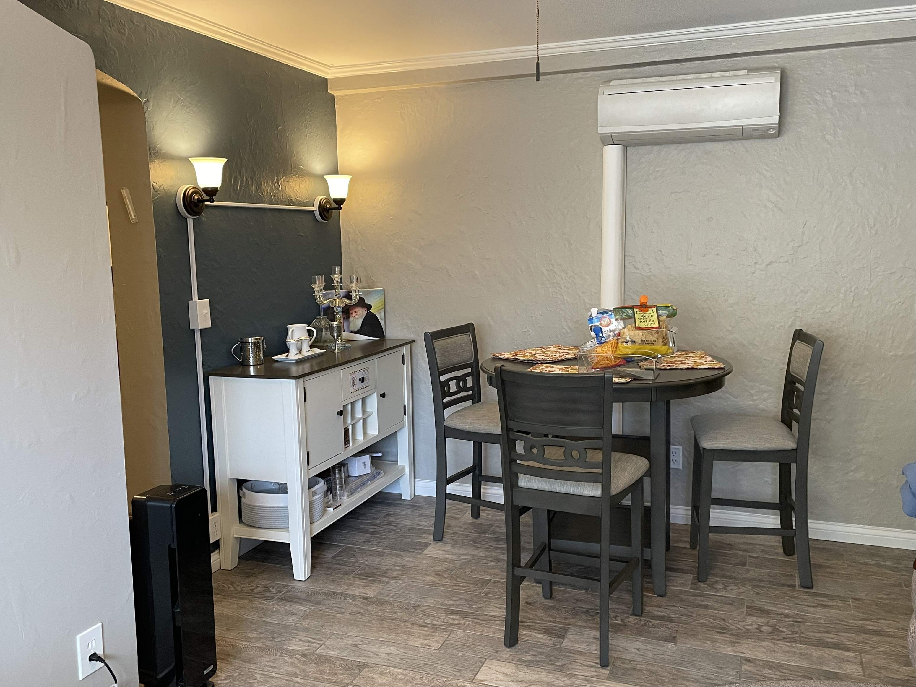 a small kitchen and dining area with a table and chairs
