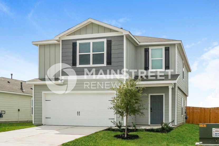 a house with a garage and a lawn