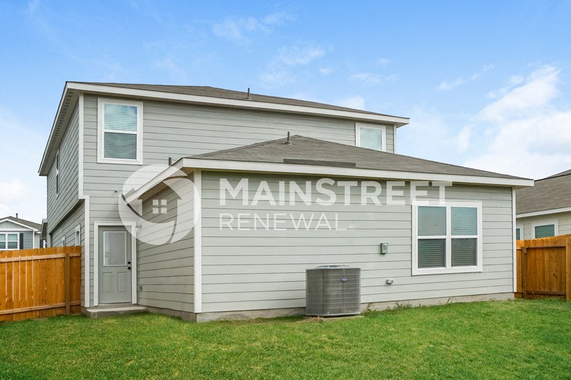 a house with the words man street renewal on the side of it